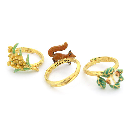 Nature-inspired stacking ring set featuring a fox, butterfly, and flower.