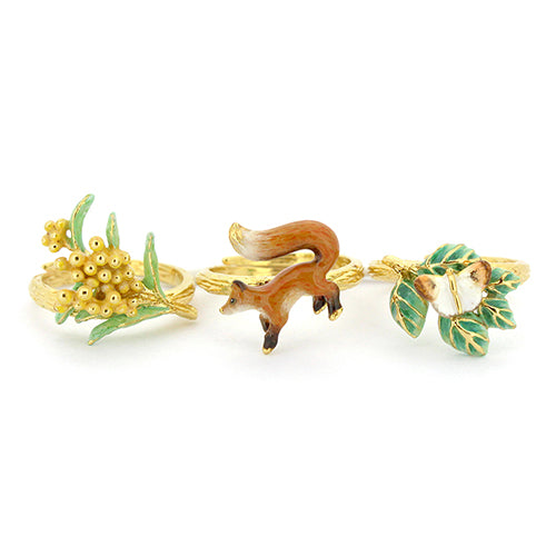 Nature-inspired stacking ring set featuring a fox, butterfly, and flower.