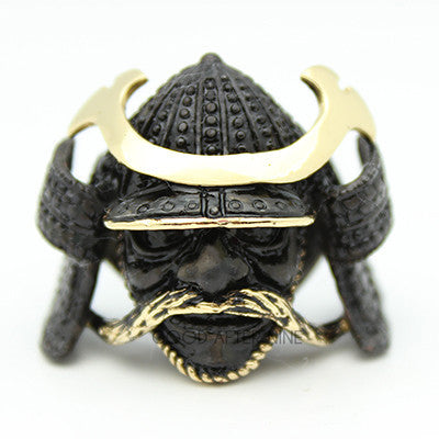 Artisan ring designed as a samurai helmet with intricate details and a gold-toned visor.