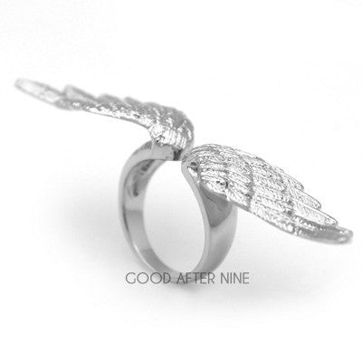 Beautiful silver ring featuring intricate wing details.