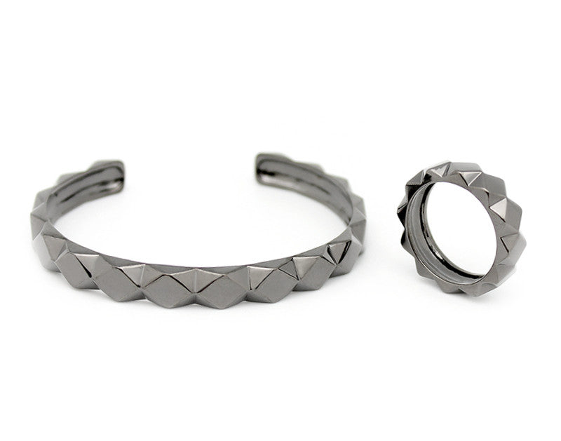 Stylish geometric metal bracelet and ring set for a bold look.