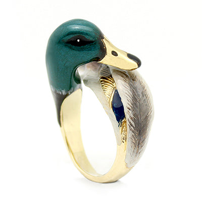 A whimsical ring featuring a duck's head and wing, beautifully crafted with colorful enamel.