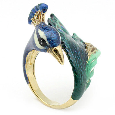 Handcrafted peacock ring with intricate details in blue and green, perfect for animal lovers.