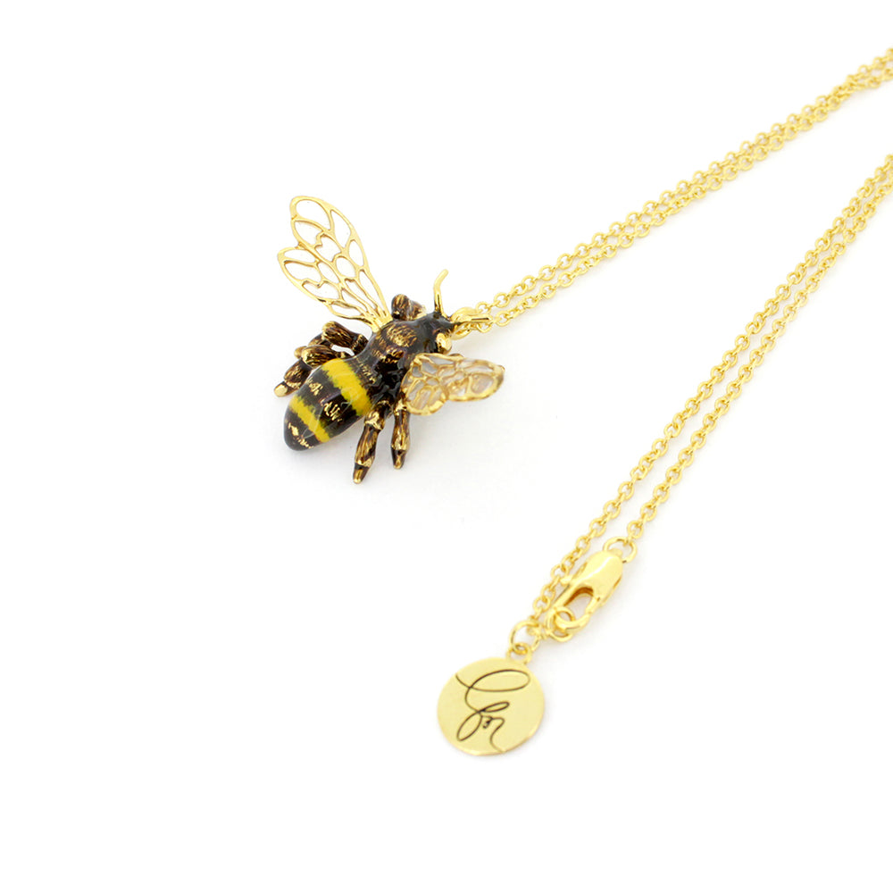 Beautiful gold bee pendant necklace with intricate wings, perfect for animal lovers.