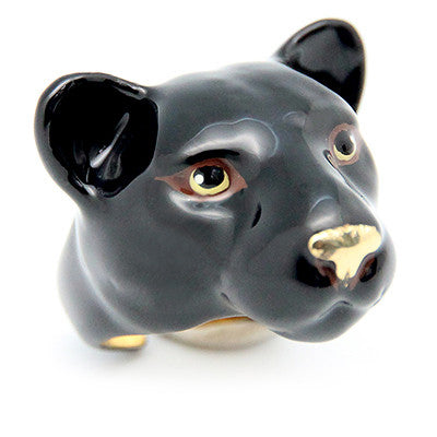 Black panther head ring with golden details for the eyes and nose.