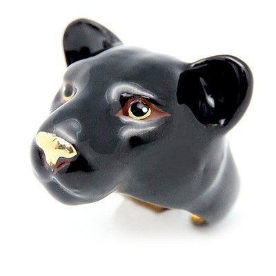 Black panther head ring with golden details for the eyes and nose.