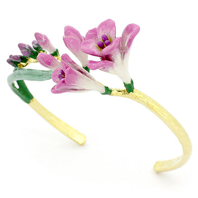 Handcrafted bangle with delicate pink flowers and green leaves.