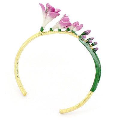 Handcrafted bangle with delicate pink flowers and green leaves.