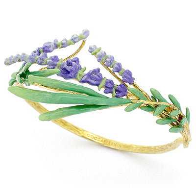 A gold bracelet adorned with green leaves and delicate purple flowers, perfect for flower lovers.