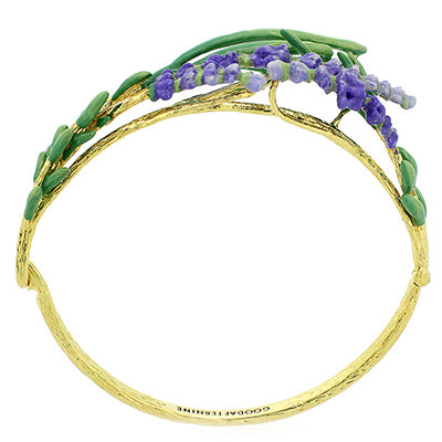 Handmade gold bracelet adorned with green leaves and delicate purple flowers