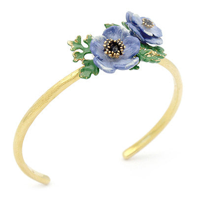 Nature-inspired bangle featuring purple flowers and green leaves.