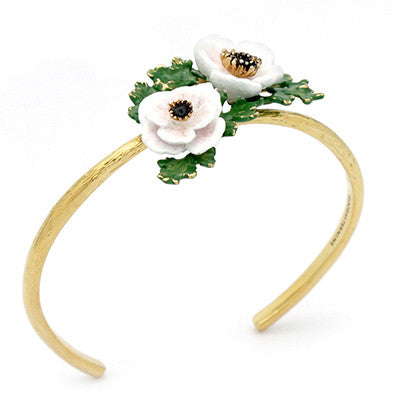 Artisan-crafted flower bangle showcasing intricate light pink, white flowers.