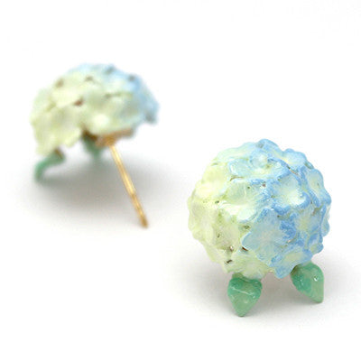 Beautiful hydrangea-inspired blue earrings with green leaves.