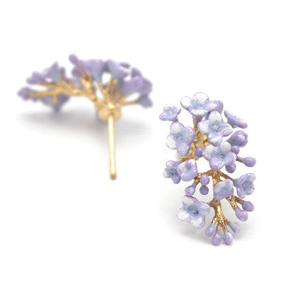 Purple floral earrings with delicate petals and gold accents.