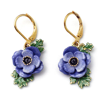 Beautiful purple anemone flower earrings with green leaves.