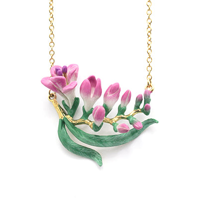 Nature-inspired necklace adorned with delicate pink flowers and leaves.