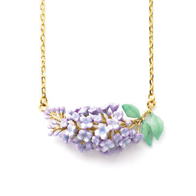 Delicate gold necklace featuring a cluster of lilac flowers and green leaves, elegantly crafted for floral charm.