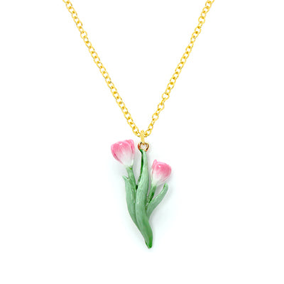 A floral necklace featuring pink tulip and green leaves on a gold chain.