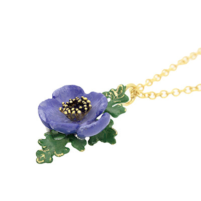 Nature-inspired necklace featuring a purple flower and green leaves. Perfect for flower lovers.