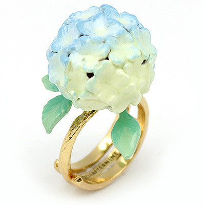 Handcrafted floral ring showcasing a beautiful blue hydrangea and green leaves.