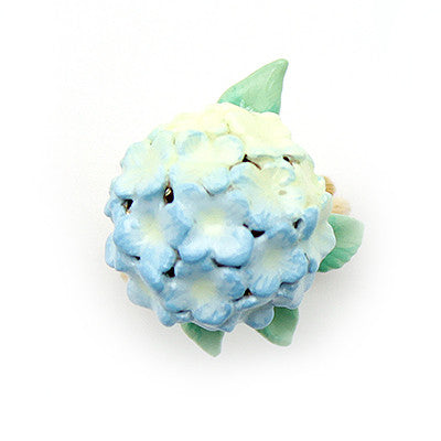 Artistic gold ring designed with a vibrant blue hydrangea and green leaves, perfect for flower lovers.