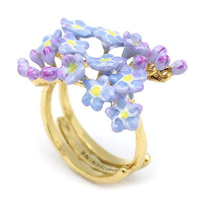 Unique floral ring with a stunning gold band and colorful flowers.