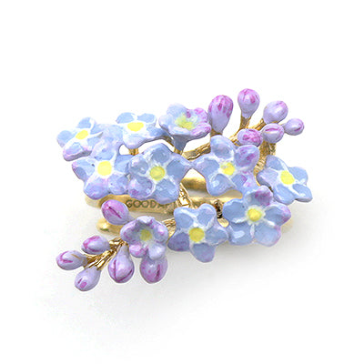 A beautiful floral gold ring adorned with purple flowers.