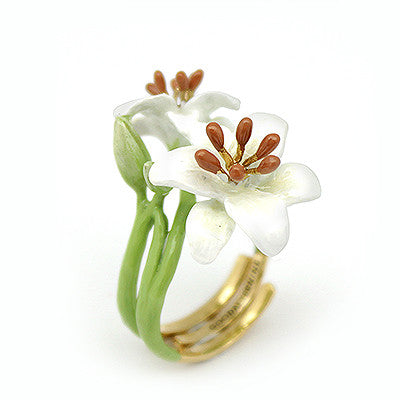 Handmade ring featuring two white flowers with brown stamens, set on a green band, accented with gold details.