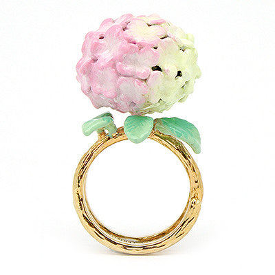 Handcrafted floral ring showcasing a beautiful soft pink hydrangea and green leaves, ideal for summer fashion.