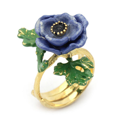 Stunning purple flower ring with green leaves, perfect for flower lovers.