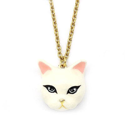 White cat pendant necklace with black eyes and pink ears on a gold chain, perfect for cat lovers.