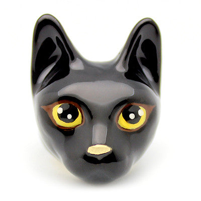 Handmade black cat head ring with large yellow eyes, and a small nose, perfect for animal lovers.