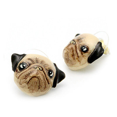 Pug-shaped earrings with detailed facial features and black ears.