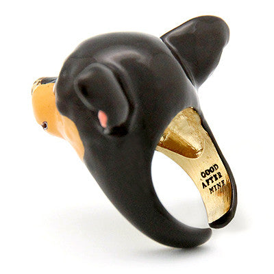 Black and tan dog-shaped ring featuring detailed craftsmanship, perfect for dog lovers.