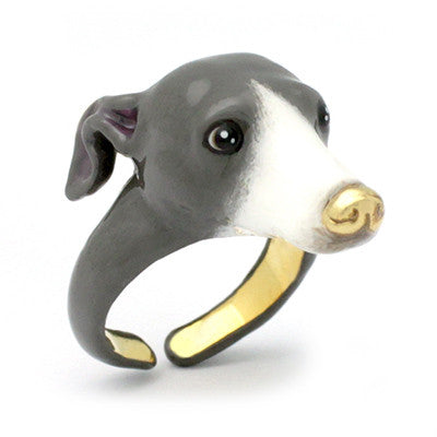 A dog's head ring featuring a grey and white color scheme with black eyes and a gold nose.