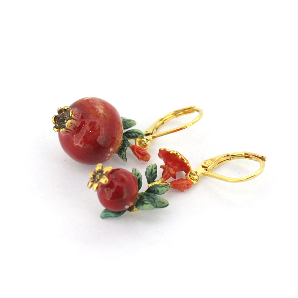 Beautiful pomegranate earrings adorned with delicate red flowers and green leaves, ideal for summer fashion.