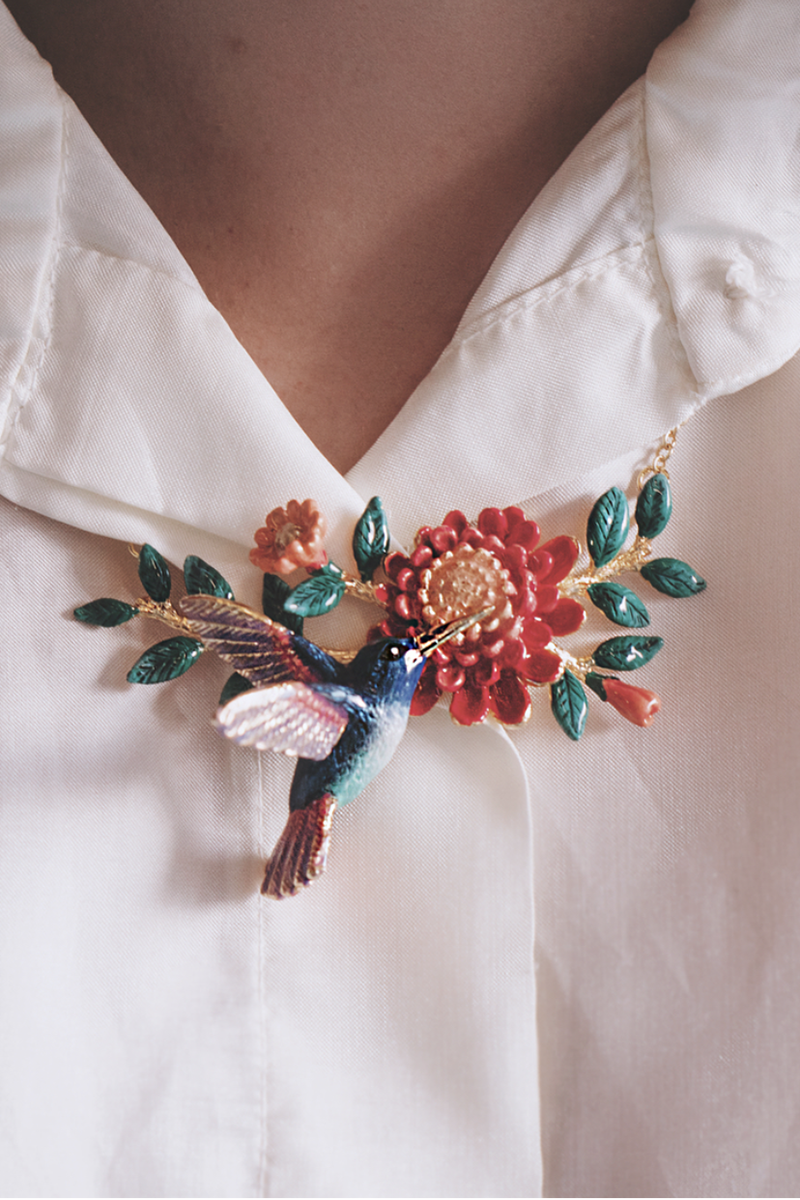 Colorful hummingbird necklace with floral design