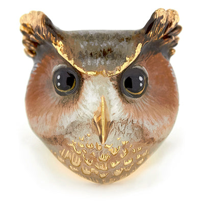 A cute great horned owl ring featuring large black eyes with a delicate golden beak and textured feathers.