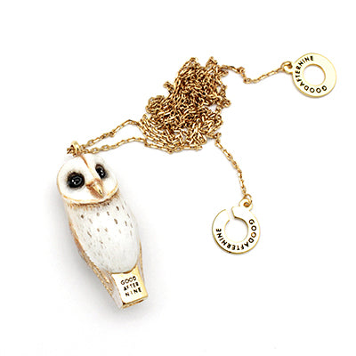 Whimsical owl-shaped whistle necklace with black eyes, and detailed feathers