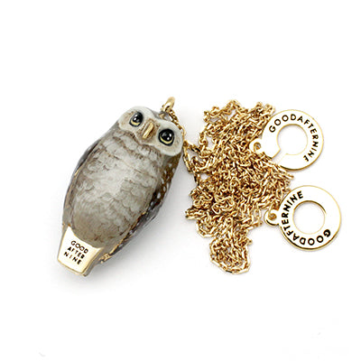 Whimsical owl-shaped whistle necklace with intricate detailing.