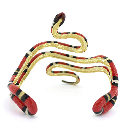 Unique bangle featuring a striking red milk snake with black and white stripes, perfect for unique jewelry lovers.