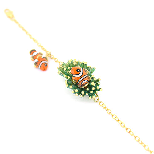 A handmade bracelet with charming clownfish charms and a unique coral design.