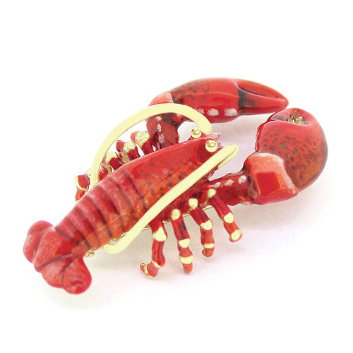 A handcrafted brooch with a lobster design, featuring vibrant red colors and gold detailing.