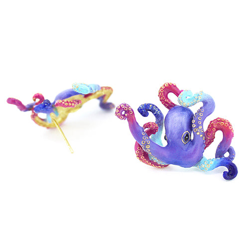 Beautifully crafted octopus earrings featuring blue, purple, and red tones.