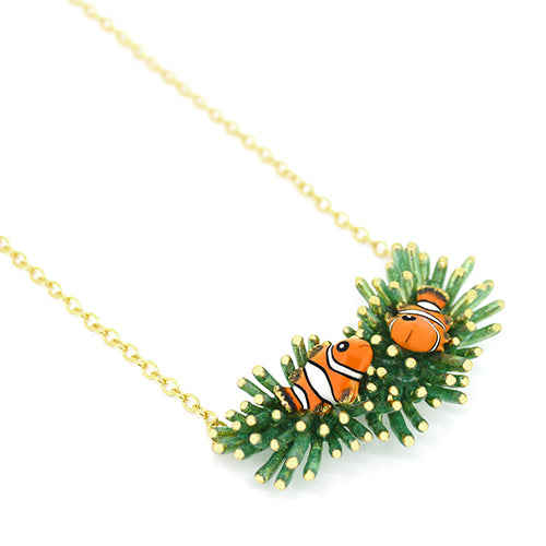 Unique handmade necklace with clownfish and green coral design.