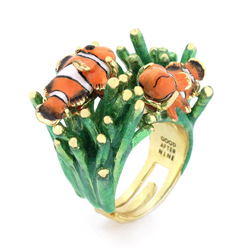 A whimsical ring featuring two clownfish on vibrant green coral.