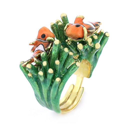 A whimsical ring featuring two clownfish on vibrant green coral.