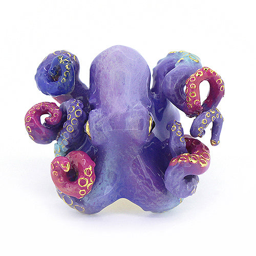 Beautifully crafted octopus ring, featuring featuring blue, purple, and red tones.