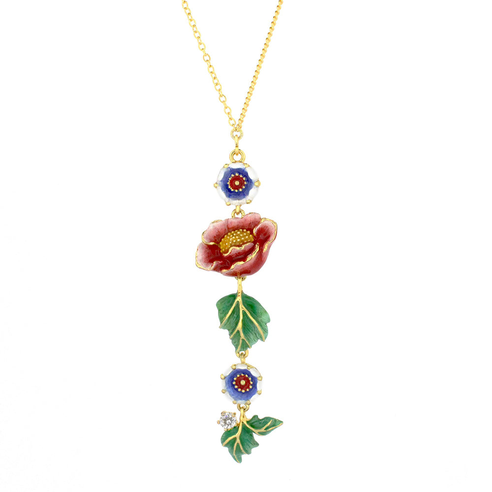 Unique necklace featuring floral and animal motifs, including a flower, blue flowers, and a tiger charm.