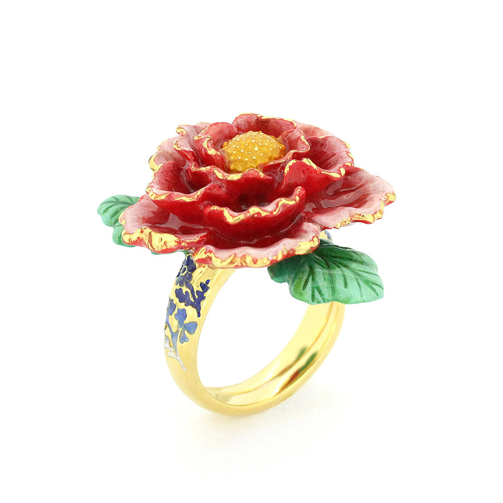 Stunning gold ring featuring a red flower design with intricate petals, a green leaf, and a small diamond accent.